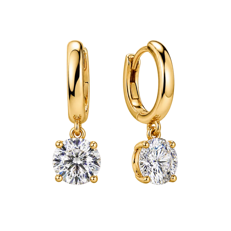 A pair of gold diamond drop earrings